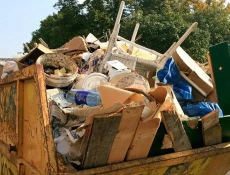 Loaded skip of mixed household waste Dartmouth Midi Skips Dartmouth